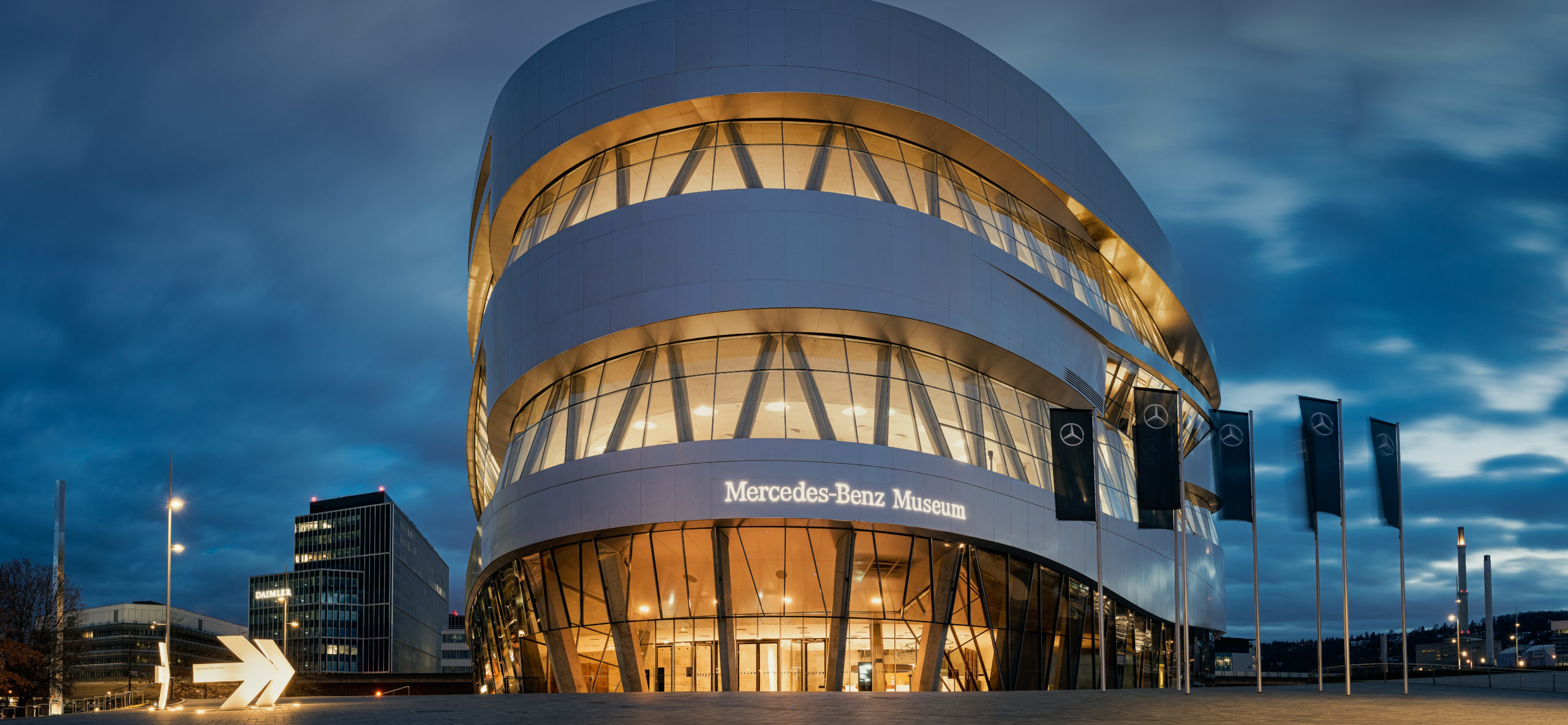 Low-angle perspective of illuminated Mercedes-Benz Museum and Da